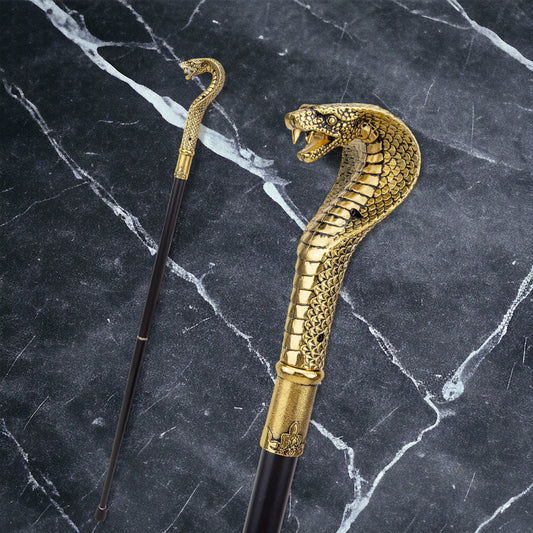 a golden snake umbrella on a marble surface